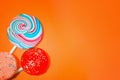 Vintage Orange Background With Colored Candy