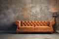 Vintage Orange Leather Sofa in a Modern Living Room with ruined wall Royalty Free Stock Photo