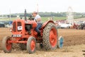 Vintage orange nuffield Tractor ploughing