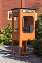 Vintage orange telephone booth Sweden Royalty Free Stock Photo
