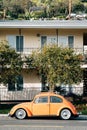 Vintage orange Volkswagen Beetle, on Pacific Coast Highway in Laguna Beach, California Royalty Free Stock Photo