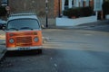 Vintage orange Volkswagen Bulli parked on the street