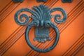 Vintage and ornate, iron ring shaped doorknocker