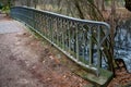 Vintage ornate metal railing fence of old bridge near pond in Tiergarten park of Berlin Germany. Tranquil landscape with nobody. Royalty Free Stock Photo