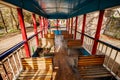 Vintage outdoor train carriage with with rows of wooden seats, old-fashioned railway carriage. Royalty Free Stock Photo