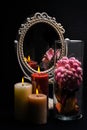 Vintage Oval Desk Mirror with white frame, potpourri, and candles reflecting in mirror on black background