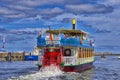 Vintage paddlwheel steamboat painted in old-fashioned, and blue reflects on the waters of a swamp. WarnemÃÂ¼nde