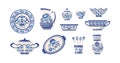 Vintage painting crockery set. Blue porcelain plates, bowls and jar decorated by floral pattern Royalty Free Stock Photo