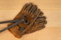 Vintage Pair Of Cutting Nippers Pliers and Work Gloves Wood Background