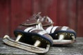 Vintage pair of mens ice skates on the bench Royalty Free Stock Photo