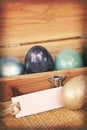 Vintage paper textures, Colorful easter egg in wood box with paper tag Royalty Free Stock Photo