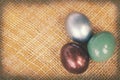 Vintage paper textures, Colorful easter eggs on bamboo weave. Royalty Free Stock Photo