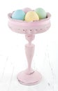 Vintage pastel color easter eggs in old vase