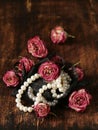 Vintage pearl with dry roses