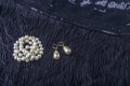 Vintage pearl jewelry on little black dress. Gatsby or Chicago fashion look. Luxury white necklace and earrings. Getting ready for