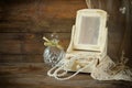 Vintage pearls , antique wooden jewelry box with mirror and perfume bottle on wooden table. filtered image