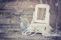 Vintage pearls , antique wooden jewelry box with mirror and perfume bottle on wooden table. filtered image Royalty Free Stock Photo