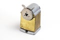 Vintage pencil sharpener on white background. Manual metal tool for sharpening wooden pencils Royalty Free Stock Photo