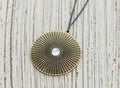 Vintage pendant on wooden