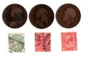 Vintage penny stamps and coins from the United Kingdom. Royalty Free Stock Photo