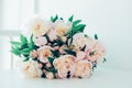 Vintage peony bouquet on white table