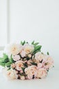 Vintage peony bouquet on white table