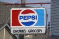 A Vintage PEPSI sign at a grocery shop