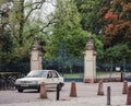 Vintage Peugeot car parked in front of beautiful gate