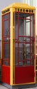 Vintage telephone booth painted in traditional colors