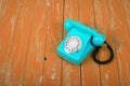 Vintage Phones - Blue retro telephone orange background Royalty Free Stock Photo