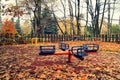 Vintage photo - abandoned playground in autumn cold day