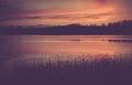 Vintage photo of beautiful sunset over calm lake Royalty Free Stock Photo