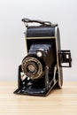 Vintage photo camera with aesthetic metallic elements, beautiful old fashioned font and leather harmonic.
