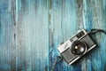 Vintage photo camera on grunge wooden background Royalty Free Stock Photo