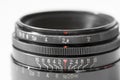 Vintage photo camera lens close up showing aperture and distance scale Royalty Free Stock Photo