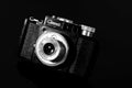 Vintage photo camera on the mirror table