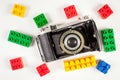 Vintage photo camera and plastic blocks