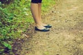 Vintage photo of close up of girl legs walking in forest Royalty Free Stock Photo