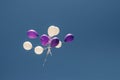 Vintage photo of colorful balloons on blue sky. Concept of love in summer, valentine, wedding and honeymoon