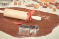 Vintage photo, Cookie cutters, rolling pin and dough for baking festive cookies or gingerbread, Christmas time concept Royalty Free Stock Photo