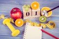 Vintage photo, Cube calendar, fruits, dumbbells and tape measure, new years resolutions