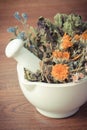 Vintage photo, Dried herbs and flowers in white mortar, herbalism, decoration Royalty Free Stock Photo