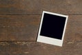 Vintage photo frame blank on old wood background Royalty Free Stock Photo