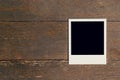 Vintage photo frame blank on old wood background Royalty Free Stock Photo