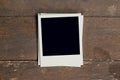 Vintage photo frame blank on old wood background Royalty Free Stock Photo