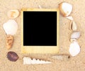 Vintage photo frame and Sea Shell on sand Royalty Free Stock Photo