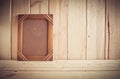 Vintage photo frame on wooden table over wood background Royalty Free Stock Photo