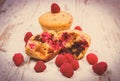 Vintage photo, Fresh baked muffins with chocolate and raspberries on wooden background, delicious dessert Royalty Free Stock Photo