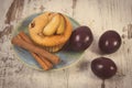 Vintage Photo, Fresh Baked Muffins With Plums And Cinnamon Sticks On Old Wooden Background, Delicious Dessert