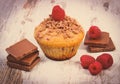 Vintage photo, Fresh baked muffins with raspberries and chocolate on wooden background, delicious dessert Royalty Free Stock Photo